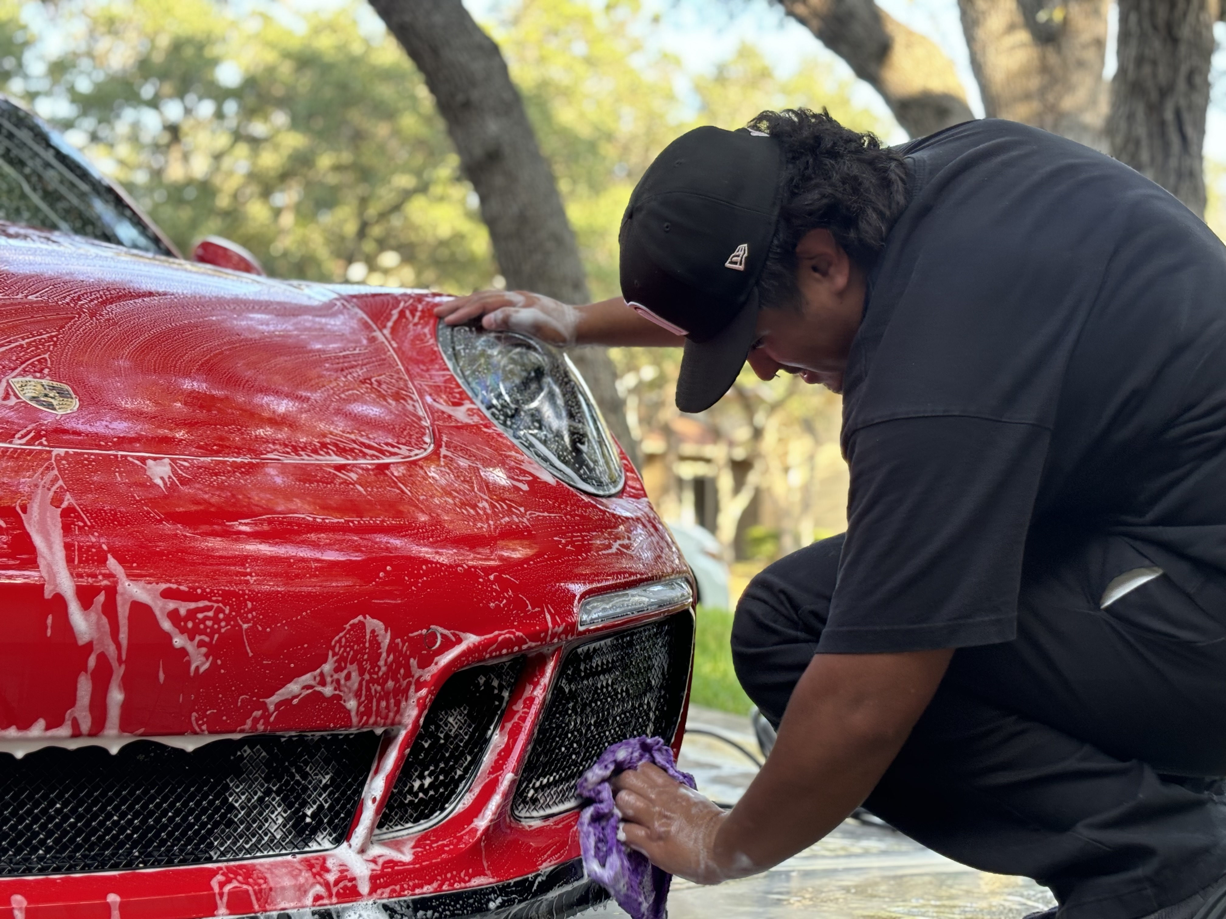 Professional detailing of red Porsche